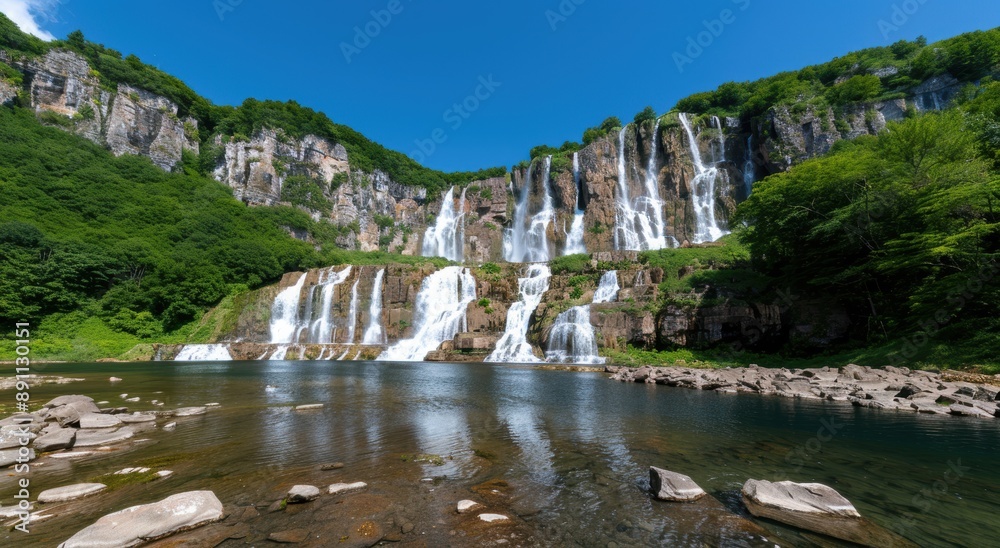 Breathtaking waterfalls cascading down lush green cliffs Breathtaking waterfalls cascading down lush green cliffs