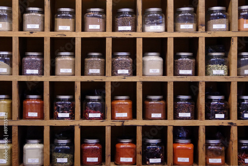 Fototapeta Naklejka Na Ścianę i Meble -  Large herb and spice jars in a shelf