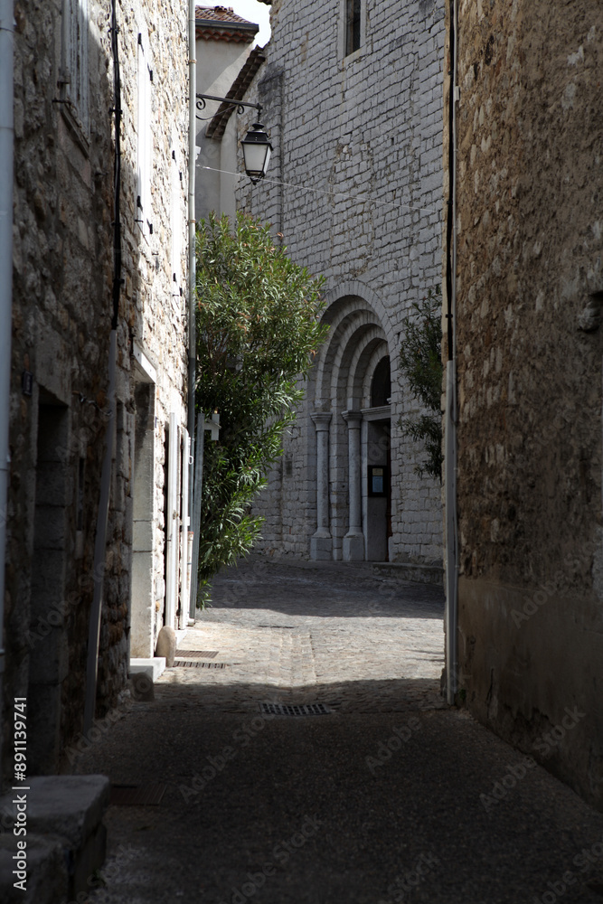 Street and church in the old town - Ruoms - Ardeche - France Street and church in the old town - Ruoms - Ardeche - France