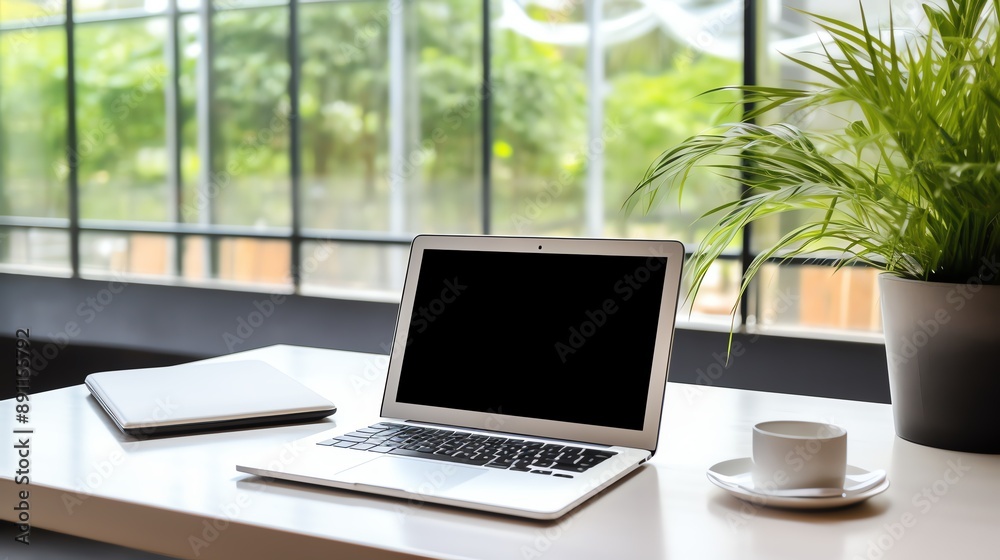A high-resolution photo of a clean and modern office workspace with a laptop and notepad, soft natural light. A high-resolution photo of a clean and modern office workspace with a laptop and notepad, soft natural light.