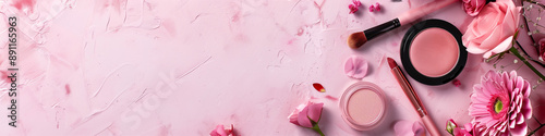 Makeup and cosmetics products set on pastel background with a copy space banner