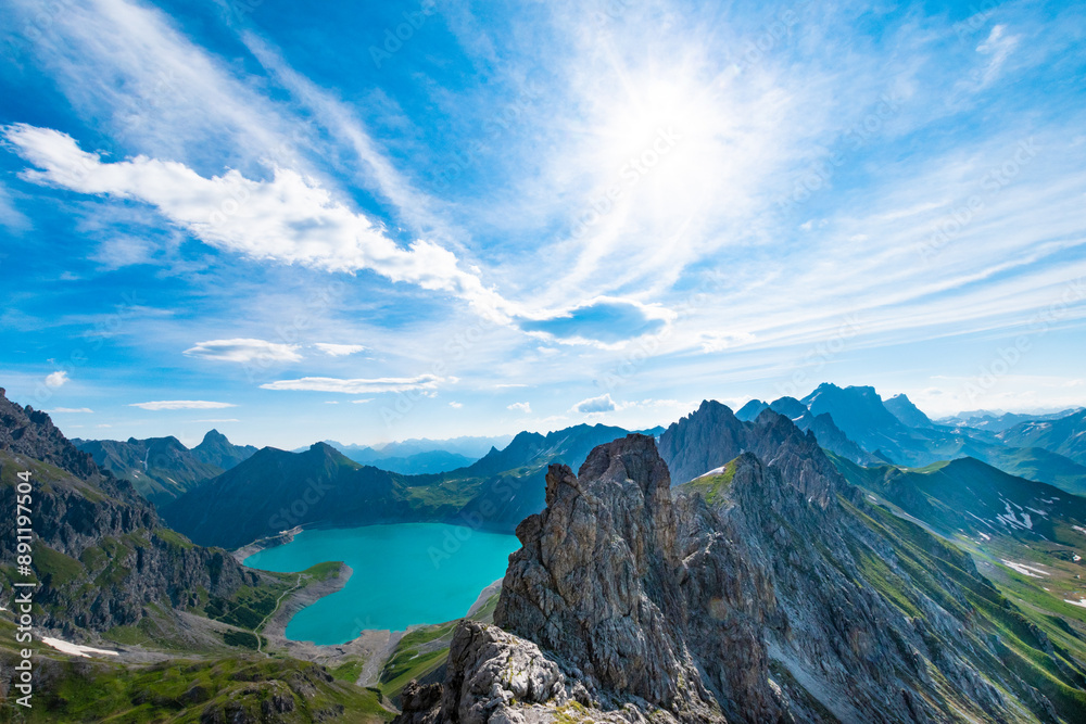 Breathtaking View Over Lünersee with Jagged Peaks and Vibrant Sky Breathtaking View Over Lünersee with Jagged Peaks and Vibrant Sky