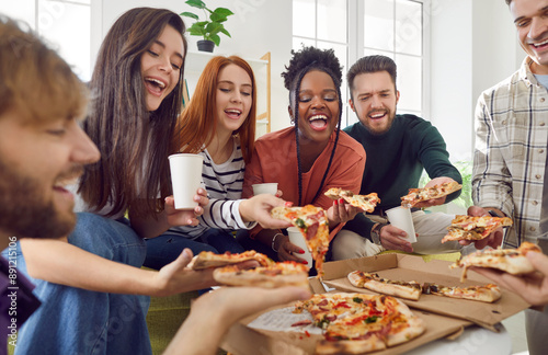 Canvas Print Gathering of friends at home, savoring pizza slices and enjoying refreshing drinks