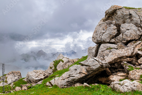 Misty Mountaintop: Clouds Enveloping Rocky Peak (Bettlerjoch, Rätikon, Lichtenstein) photo