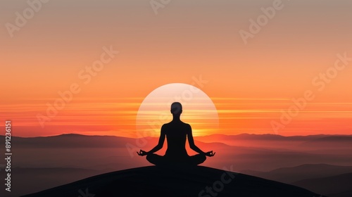 Silhouette of a person sitting in meditation with a sunrise background © MarkFinal