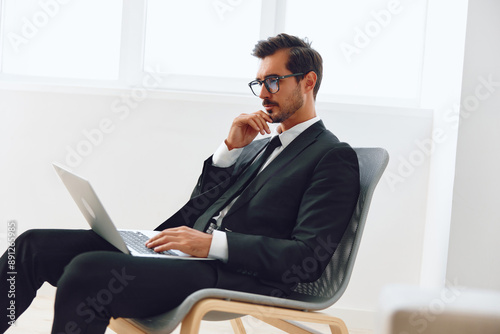 Winner man success chair happy laptop business excited office technology job businessman