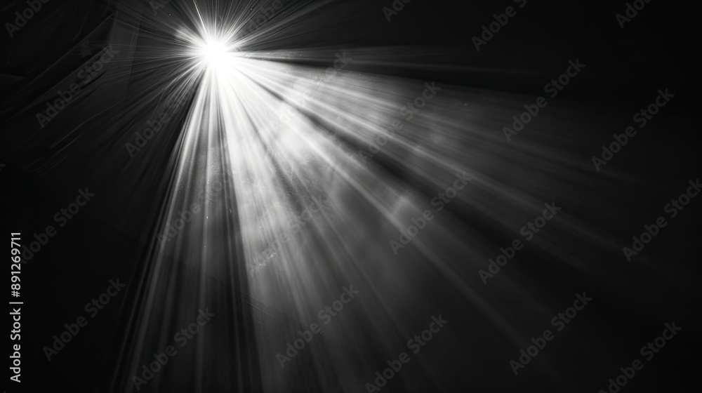 Bright beam of light shining in the blackness, close-up on black Bright beam of light shining in the blackness, close-up on black
