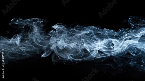 Wisps of ghostly smoke floating on a black background, haunting and eerie