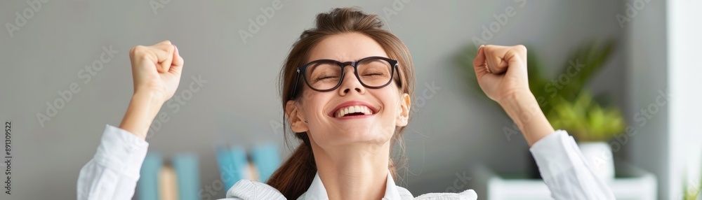 Triumph in the Workplace - Joyful Employee Celebrating a Successful Resolution in Modern Office Environment Triumph in the Workplace - Joyful Employee Celebrating a Successful Resolution in Modern Office Environment