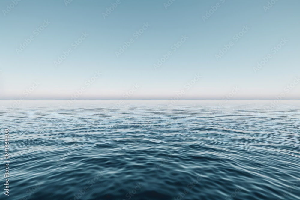 Obraz premium An expansive view of the ocean, stretching infinitely under a clear, blue sky. The water is calm and serene, creating a sense of peace and endless possibility.