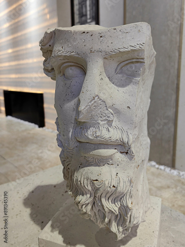 Details of a ancient statue stone marble face. photo