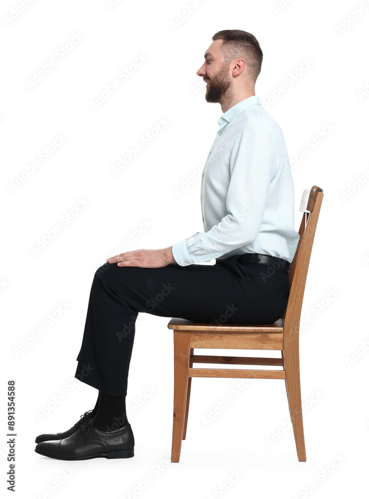 Man with good posture sitting on chair against white background Man with good posture sitting on chair against white background