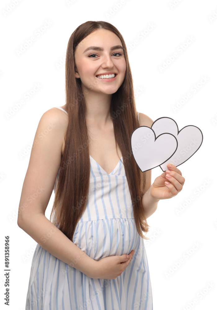 Expecting twins. Pregnant woman holding two paper cutouts of hearts on white background Expecting twins. Pregnant woman holding two paper cutouts of hearts on white background