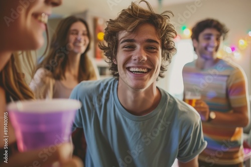Group of young adults having fun at home party