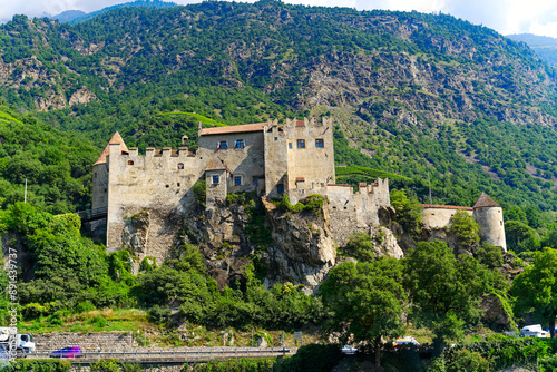 Scenic view of castle named Kastelbell at mountain village of Latsch on a sunny summer day. Photo taken July 19th, 2024, Latsch, Italy. photo