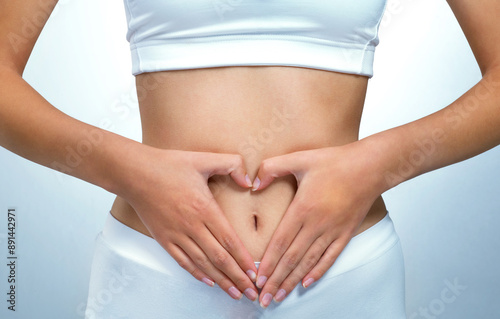Wallpaper Mural Closeup, heart hands and woman with stomach, wellness and gut health on white studio background. Person, symbol for love and girl in underwear, fibre and diet with nutrition, abdomen and tummy tuck Torontodigital.ca
