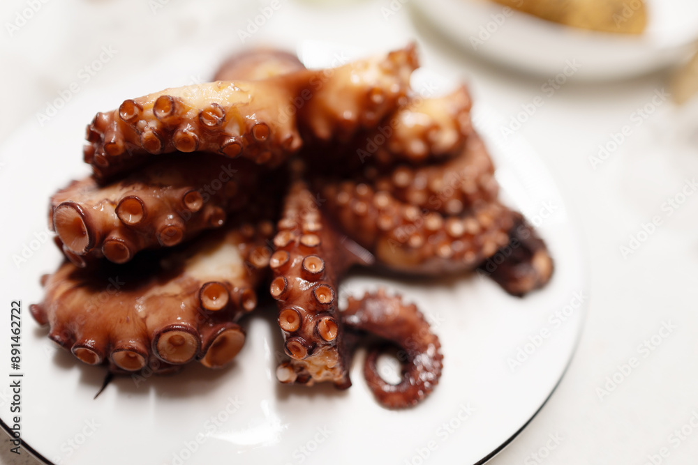 Boiled red octopus is taken out of the pan. Boiled red octopus is taken out of the pan.