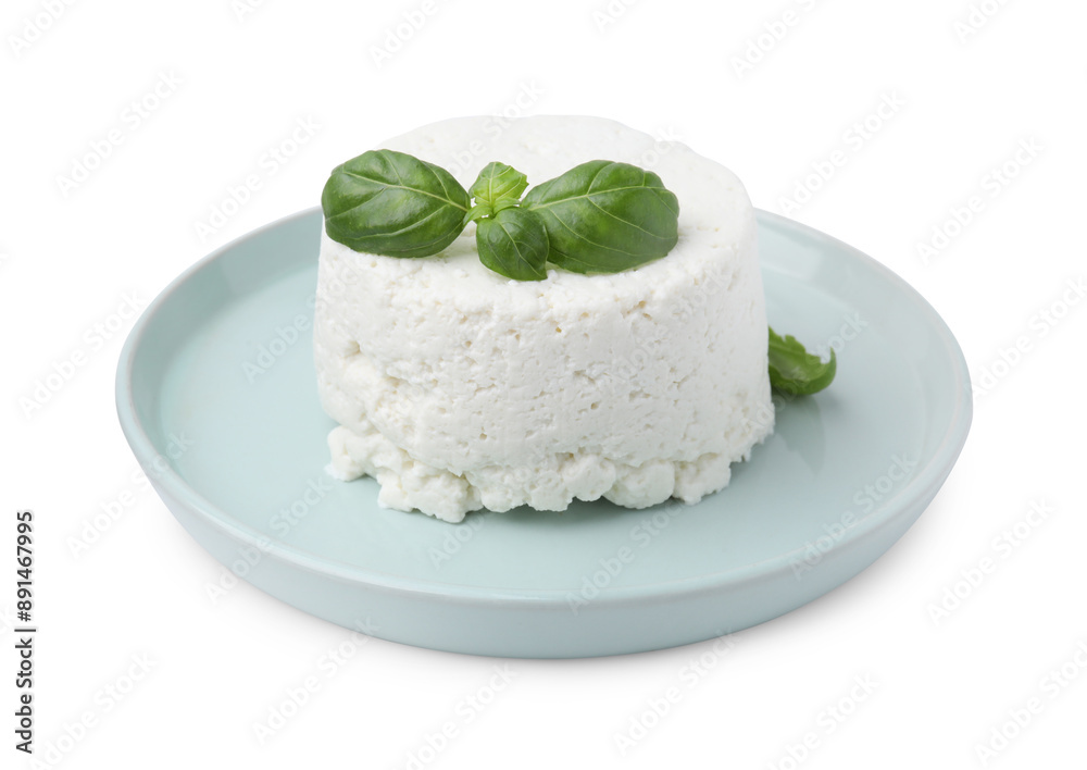 Fresh ricotta (cream cheese) and basil isolated on white