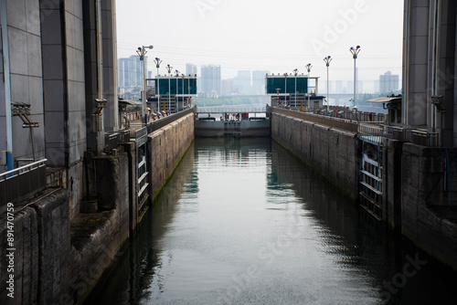 Traffic boat door navigation lock of Three Gorges Dam spillway ship lift in Yiling for chinese traveler travel and vessel journey passed Sanxia Daba Reservoir to Yichang on May 8, 2024 in Hubei, China photo