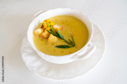 pumpkin soup beautiful decorated by bread and vegetable flower