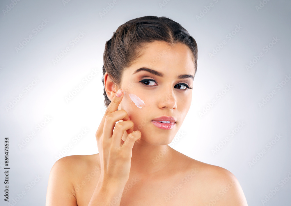 Skincare, thinking and woman in studio with cream, cosmetics and make up foundation. Dermatology, female person and facial care on gray background with moisturizer, lotion and treatment for soft skin Skincare, thinking and woman in studio with cream, cosmetics and make up foundation. Dermatology, female person and facial care on gray background with moisturizer, lotion and treatment for soft skin