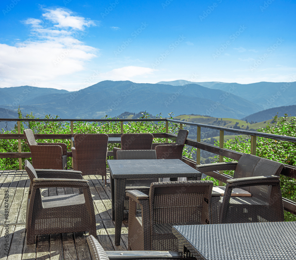 Cafe terrace with wicker furniture on a summer day. Cafe terrace with wicker furniture on a summer day.