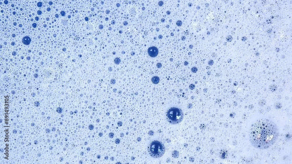 Soapy foam texture with bursting soap bubbles Soapy foam texture with bursting soap bubbles