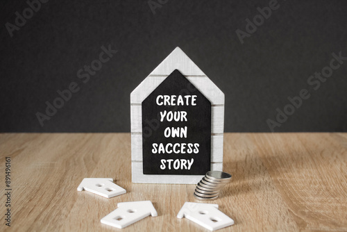 Concept words Create your own success story on the brick blocks. Blue background, wooden table. Educational life and business motivational inspirational.