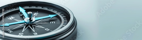 A compass with a blue arrow pointing to the E