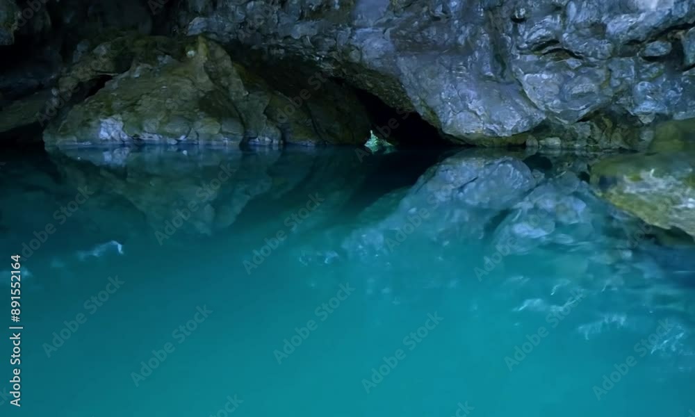 Beauty in a cave filled with many rocks and water Beauty in a cave filled with many rocks and water