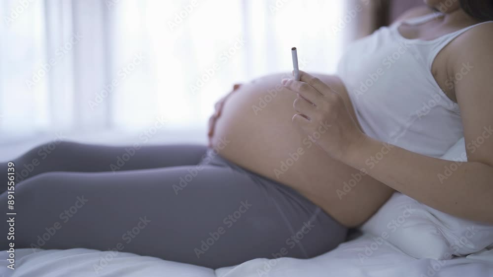 pregnant mom smoking cigarettes 1 in 14 women still smokes Pregnant woman | Stock Image