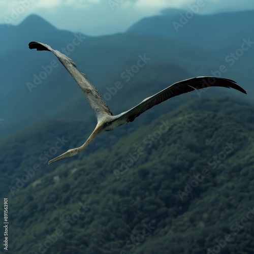 Quetzalcoatlus soaring over a mountain range, majestic and highly realistic, [Dinosaur], [Prehistoric Flight]