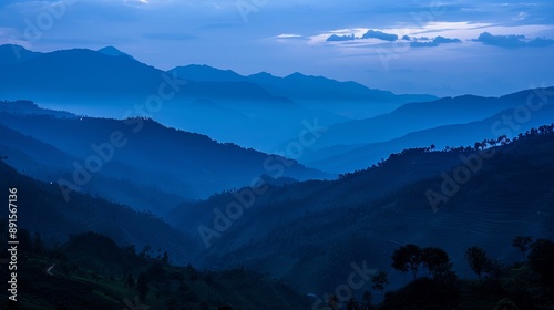 Fototapeta Naklejka Na Ścianę i Meble -  A blue hour landscape shot taken just after sunset in Manipur, India, with the eastern end of the Himalayas visible as a silhouetted structure.