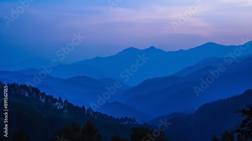 A blue hour landscape shot taken just after sunset in Manipur, India, with the eastern end of the Himalayas visible as a silhouetted structure.