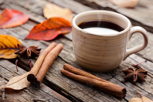 Autumn Coffee with Leaves and Cinnamon on Rustic Table
 photo