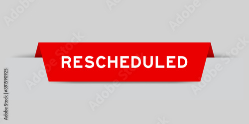 Red color inserted label with word rescheduled on gray background