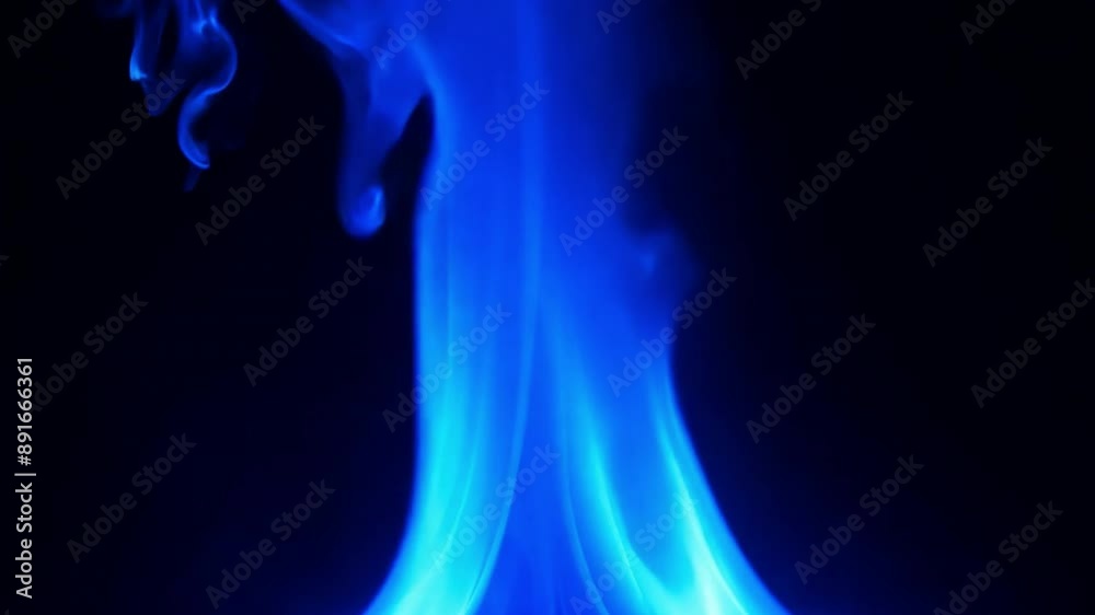 Blue gas flames against a dark background Blue gas flames against a dark background