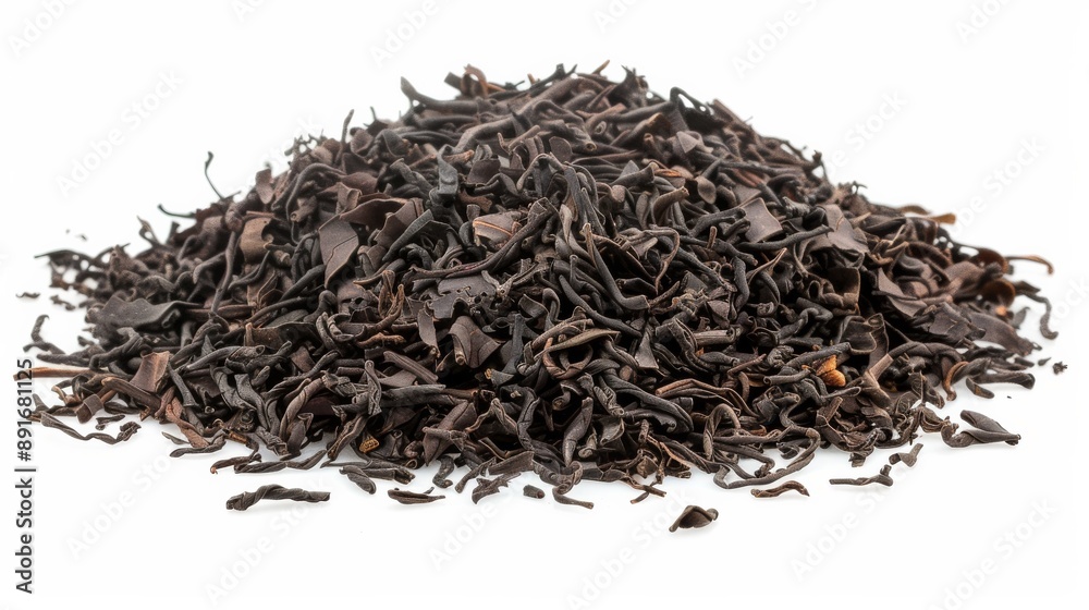 Dry black tea leaves pile isolated on white background, top view. Food isolated on white. Photo realistic photo. Dry black tea leaves pile isolated on white background, top view. Food isolated on white. Photo realistic photo.