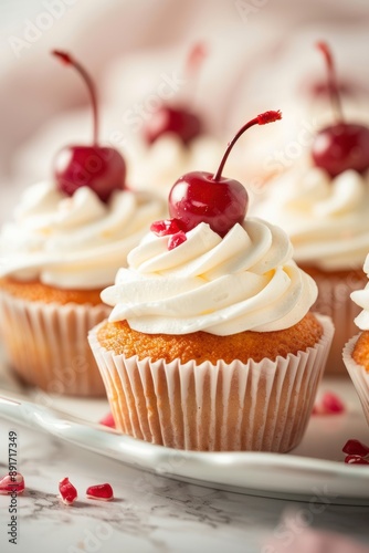 Delicious cupcake topped with creamy frosting and fresh cherry, perfect for parties and celebrations. photo