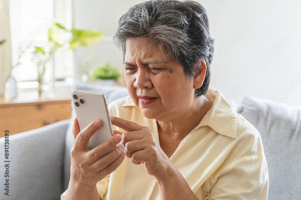 Elderly woman have eyesight problem can not read because seeing text blurred and headache from eye tired. Elderly woman have eyesight problem can not read because seeing text blurred and headache from eye tired.