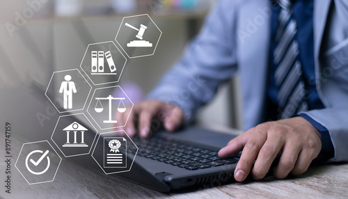 Businessman touching law icons on virtual screen for business legal advice, Labor law, Lawyer, Attorney at law, Legal advice business concept.