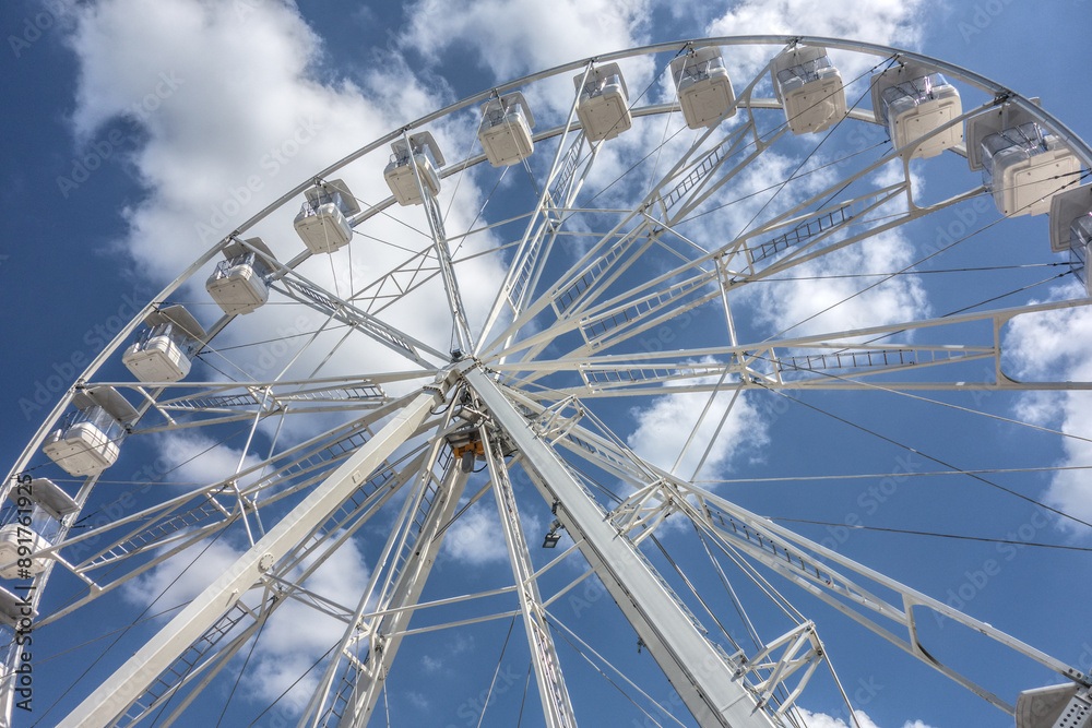 Fototapeta premium The Ferris Wheel attraction is located in Luzhniki Park and is a large wheel with open cabins offering a magnificent view of Moscow.