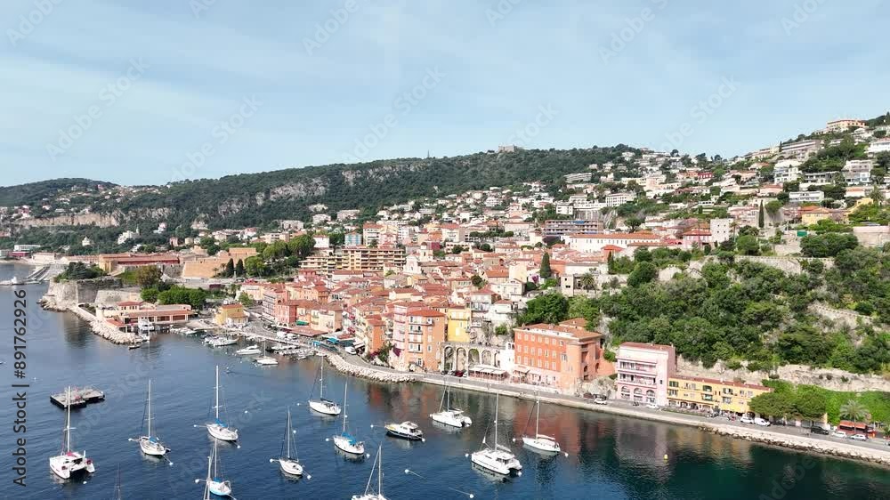 360° aerial drone view of Villefranche-sur-Mer, France, showcasing the stunning Côte d'Azur coastline and the sparkling Mediterranean Sea. 360° aerial drone view of Villefranche-sur-Mer, France, showcasing the stunning Côte d'Azur coastline and the sparkling Mediterranean Sea.