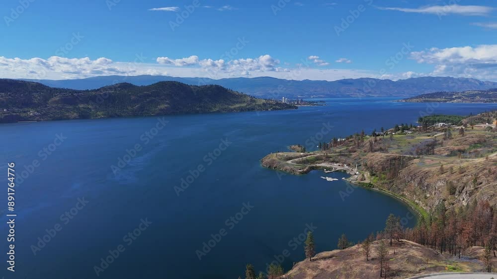 Aerial view (pan right) of Okanagan Lake at Westside Road during a spring season in West Kelowna, British Columbia, Canada Aerial view (pan right) of Okanagan Lake at Westside Road during a spring season in West Kelowna, British Columbia, Canada