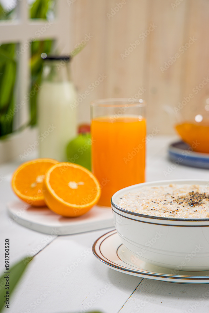 Oatmeal, healthy food item arranged on wooden background in a ceramic bowl. Oatmeal, healthy food item arranged on wooden background in a ceramic bowl.