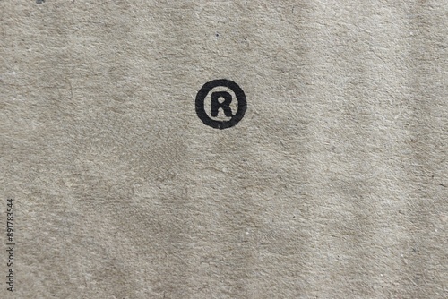 Registered trademark symbol -R- on the cardboard surface.