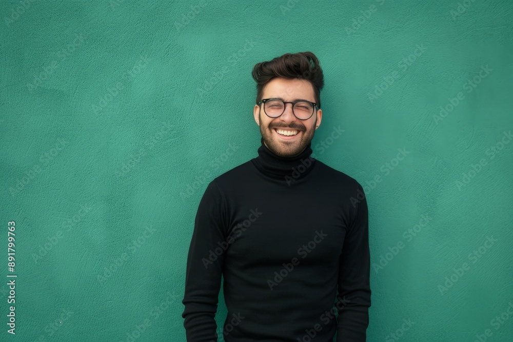 Smiling Man in Glasses, Black Turtleneck, Against Green Wall Smiling Man in Glasses, Black Turtleneck, Against Green Wall