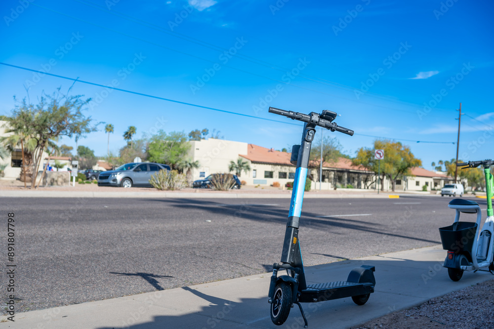 Fototapeta premium Selective focus on front wheel of a rental electric scooter in Phoenix, Arizona 