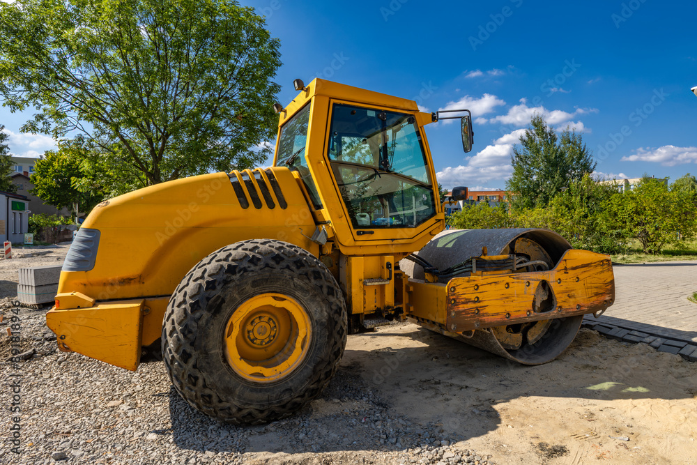 Heavy construction equipment road roller while working on road construction Heavy construction equipment road roller while working on road construction