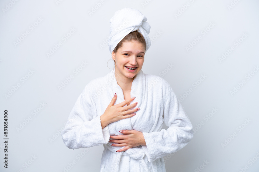 Teenager Russian girl in a bathrobe isolated on white background smiling a lot Teenager Russian girl in a bathrobe isolated on white background smiling a lot